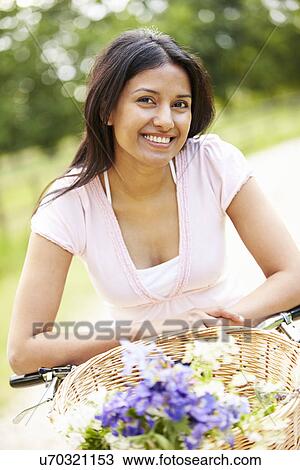 Indian Woman On Cycle Ride In Countryside View Large Photo Image Stock Image - Indian Woman On Cycle Ride In Countryside. Fotosearch