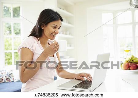 Indian Woman Using Laptop At Home View Large Photo Image Stock Photography - Indian Woman Using Laptop At Home. Fotosearch