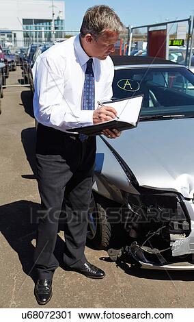 Loss Adjuster Inspecting Car Involved In Accident View Large Photo Image Stock Image - Loss Adjuster Inspecting Car Involved In Accident. Fotosearch
