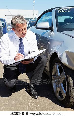 Loss Adjuster Inspecting Car Involved In Accident View Large Photo Image Stock Photograph - Loss Adjuster Inspecting Car Involved In Accident. Fotosearch
