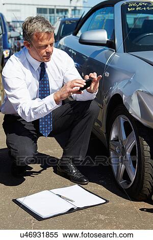 Loss Adjuster Inspecting Car Involved In Accident View Large Photo Image Stock Photography - Loss Adjuster Inspecting Car Involved In Accident. Fotosearch