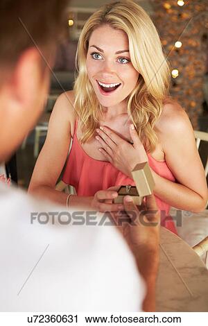 Man Proposing To Woman In Restaurant View Large Photo Image Stock Image - Man Proposing To Woman In Restaurant. Fotosearch