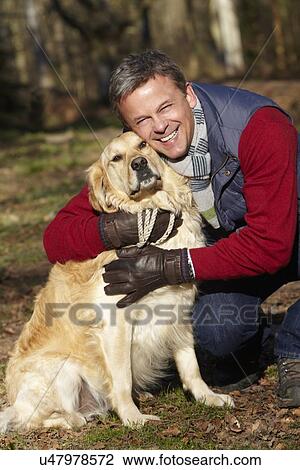 Man Taking Dog On Walk Through Autumn Woods View Large Photo Image Stock Image - Man Taking Dog On Walk Through Autumn Woods. Fotosearch