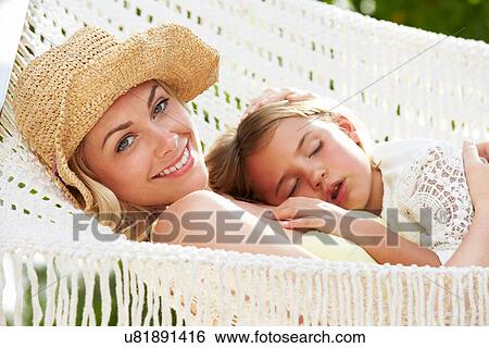 Mother And Daughter Relaxing In Beach Hammock View Large Photo Image Stock Photograph - Mother And Daughter Relaxing In Beach Hammock. Fotosearch