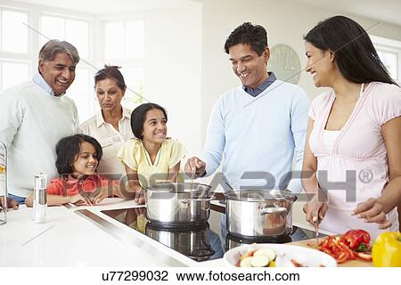 Multi Generation Indian Family Cooking Meal At Home View Large Photo Image Stock Image - Multi Generation Indian Family Cooking Meal At Home. Fotosearch