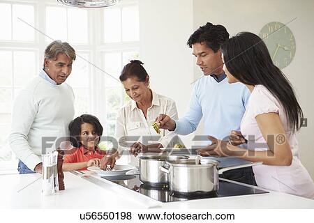 Multi Generation Indian Family Cooking Meal At Home View Large Photo Image Stock Photo - Multi Generation Indian Family Cooking Meal At Home. Fotosearch