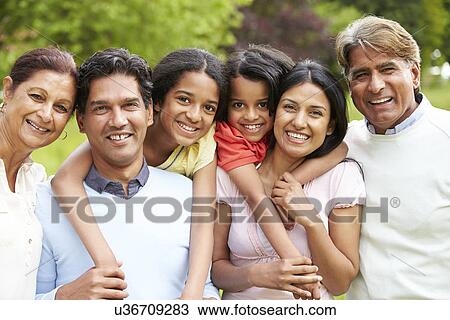 Stock Image - Muti-Generation Indian Family Walking In Countryside. Fotosearch