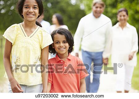 Muti-Generation Indian Family Walking In Countryside View Large Photo Image Stock Image - Muti-Generation Indian Family Walking In Countryside. Fotosearch