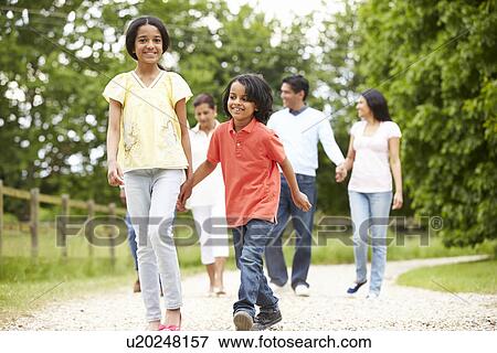 Muti-Generation Indian Family Walking In Countryside View Large Photo Image Stock Photo - Muti-Generation Indian Family Walking In Countryside. Fotosearch