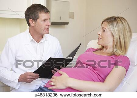 Nurse Using Digital Tablet In Meeting With Pregnant Woman View Large Photo Image Stock Photograph - Nurse Using Digital Tablet In Meeting With Pregnant Woman. Fotosearch
