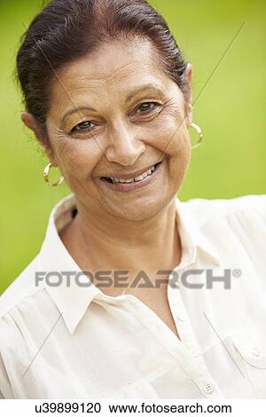 Stock Image - Outdoor Portrait Of Senior Indian Woman. Fotosearch