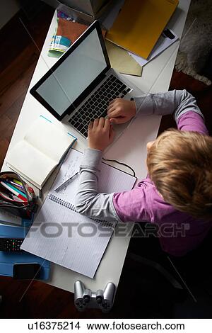 Overhead View Of Boy Studying In Bedroom Using Laptop View Large Photo Image Picture - Overhead View Of Boy Studying In Bedroom Using Laptop. Fotosearch