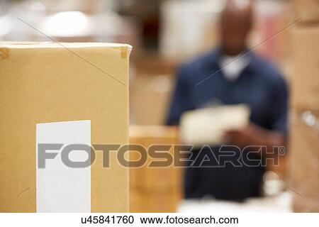 Stock Image - Package Ready For Dispatch In Warehouse. Fotosearch