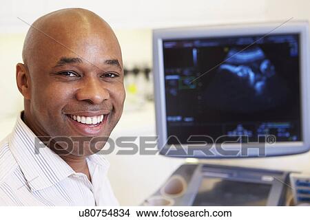Picture - Portrait Of 4D Ultrasound Scanning Machine Operator. Fotosearch