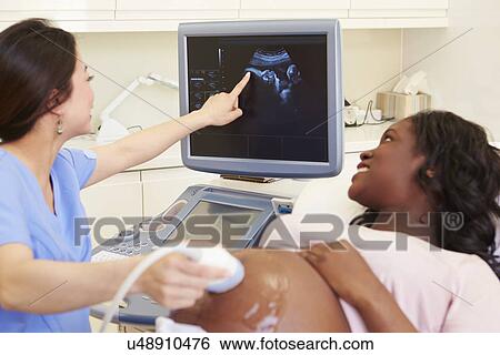Portrait Of Doctor With 4D Ultrasound Scanning Machine View Large Photo Image Stock Photograph - Portrait Of Doctor With 4D Ultrasound Scanning Machine . Fotosearch