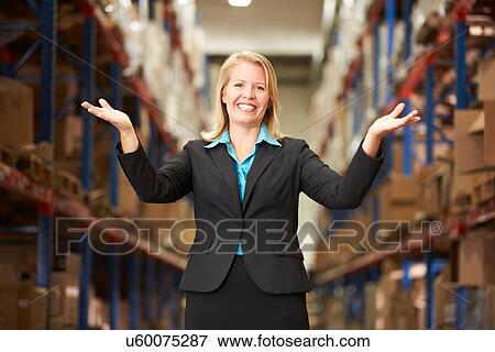 Stock Photo - Portrait Of Female Manager In Warehouse. Fotosearch