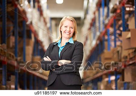 Portrait Of Female Manager In Warehouse View Large Photo Image Stock Photo - Portrait Of Female Manager In Warehouse. Fotosearch