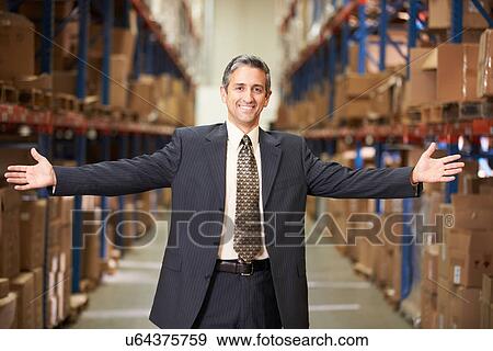 Stock Photo - Portrait Of Manager In Warehouse. Fotosearch