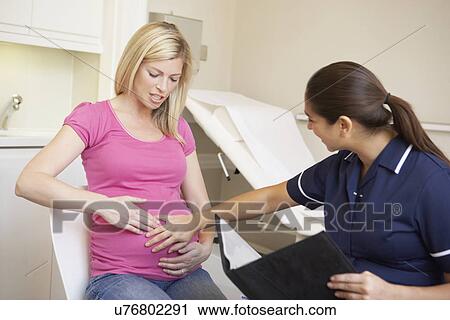 Stock Image - Portrait Of Nurse In Surgery. Fotosearch