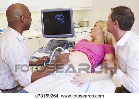 Pregnant Woman And Partner Having 4D Ultrasound Scan View Large Photo Image Picture - Pregnant Woman And Partner Having 4D Ultrasound Scan. Fotosearch