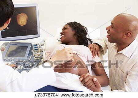 Pregnant Woman And Partner Having 4D Ultrasound Scan View Large Photo Image Picture - Pregnant Woman And Partner Having 4D Ultrasound Scan. Fotosearch
