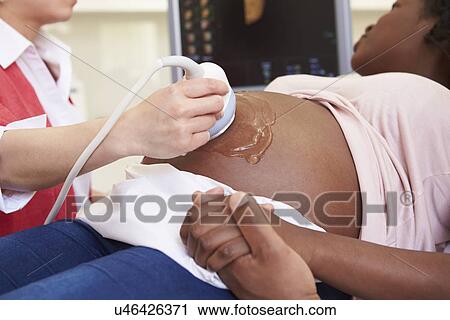 Pregnant Woman And Partner Having 4D Ultrasound Scan View Large Photo Image Stock Image - Pregnant Woman And Partner Having 4D Ultrasound Scan. Fotosearch