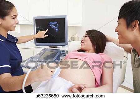 Pregnant Woman And Partner Having 4D Ultrasound Scan View Large Photo Image Stock Image - Pregnant Woman And Partner Having 4D Ultrasound Scan. Fotosearch