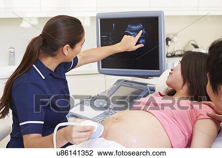 Pregnant Woman And Partner Having 4D Ultrasound Scan View Large Photo Image Stock Image - Pregnant Woman And Partner Having 4D Ultrasound Scan. Fotosearch