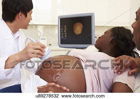 Pregnant Woman And Partner Having 4D Ultrasound Scan View Large Photo Image Stock Image - Pregnant Woman And Partner Having 4D Ultrasound Scan. Fotosearch