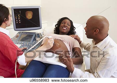 Pregnant Woman And Partner Having 4D Ultrasound Scan View Large Photo Image Stock Image - Pregnant Woman And Partner Having 4D Ultrasound Scan. Fotosearch