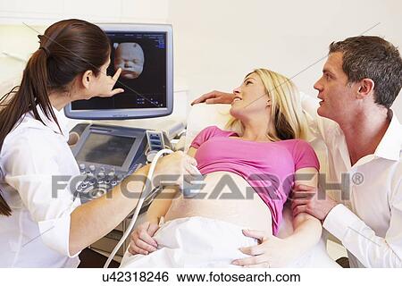 Pregnant Woman And Partner Having 4D Ultrasound Scan View Large Photo Image Stock Photograph - Pregnant Woman And Partner Having 4D Ultrasound Scan. Fotosearch