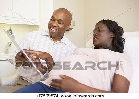 Pregnant Woman Being Given Ante Natal Check By Doctor View Large Photo Image Picture - Pregnant Woman Being Given Ante Natal Check By Doctor. Fotosearch