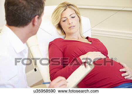 Pregnant Woman Being Given Ante Natal Check By Doctor View Large Photo Image Stock Image - Pregnant Woman Being Given Ante Natal Check By Doctor. Fotosearch