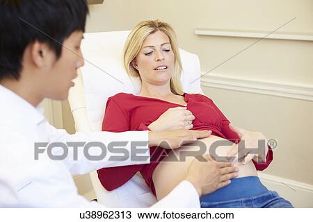 Pregnant Woman Being Given Ante Natal Check By Doctor View Large Photo Image Stock Image - Pregnant Woman Being Given Ante Natal Check By Doctor. Fotosearch