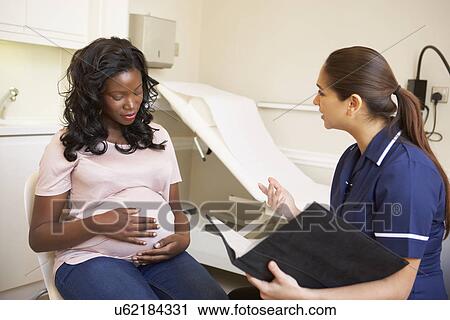 Pregnant Woman Being Given Ante Natal Check By Doctor View Large Photo Image Stock Image - Pregnant Woman Being Given Ante Natal Check By Doctor. Fotosearch