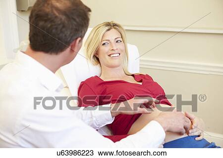 Pregnant Woman Being Given Ante Natal Check By Doctor View Large Photo Image Stock Image - Pregnant Woman Being Given Ante Natal Check By Doctor. Fotosearch