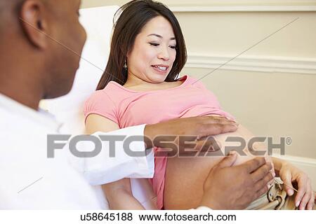 Pregnant Woman Being Given Ante Natal Check By Doctor View Large Photo Image Stock Photo - Pregnant Woman Being Given Ante Natal Check By Doctor. Fotosearch