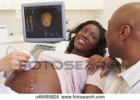 Picture - Pregnant Woman Having 4D Ultrasound Scan. Fotosearch