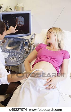 Pregnant Woman Having 4D Ultrasound Scan View Large Photo Image Picture - Pregnant Woman Having 4D Ultrasound Scan. Fotosearch
