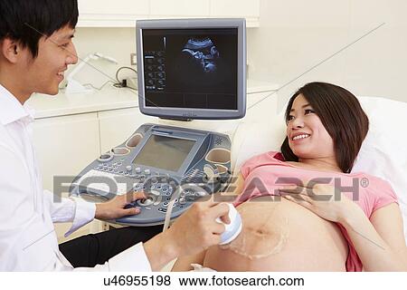 Stock Photo - Pregnant Woman Having 4D Ultrasound Scan. Fotosearch