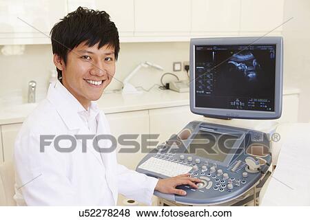 Stock Photo - Pregnant Woman Having 4D Ultrasound Scan. Fotosearch