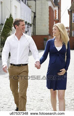 Pregnant Woman Walking Along Urban Sidewalk View Large Photo Image Stock Photo - Pregnant Woman Walking Along Urban Sidewalk. Fotosearch