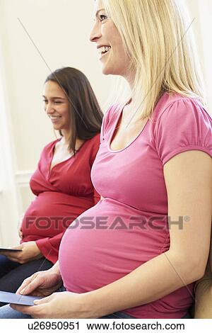 Stock Image - Pregnant Women Meeting At Ante Natal Class. Fotosearch