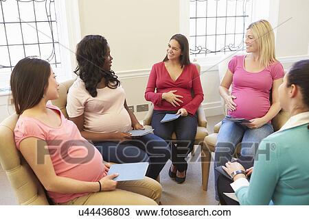 Stock Image - Pregnant Women Meeting At Ante Natal Class. Fotosearch