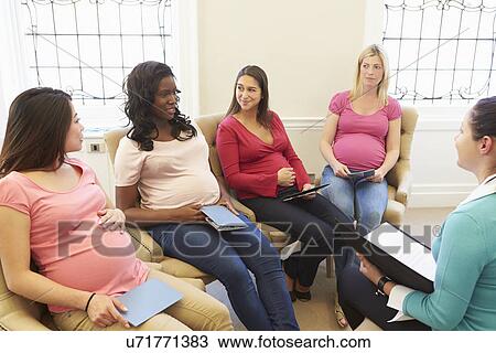 Pregnant Women With Partners At Ante Natal Class View Large Photo Image Stock Image - Pregnant Women With Partners At Ante Natal Class. Fotosearch