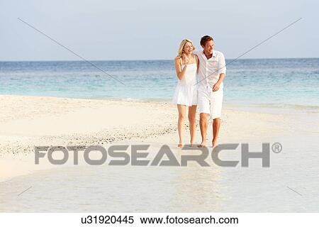Romantic Couple Walking On Beautiful Tropical Beach View Large Photo Image Stock Photography - Romantic Couple Walking On Beautiful Tropical Beach. Fotosearch