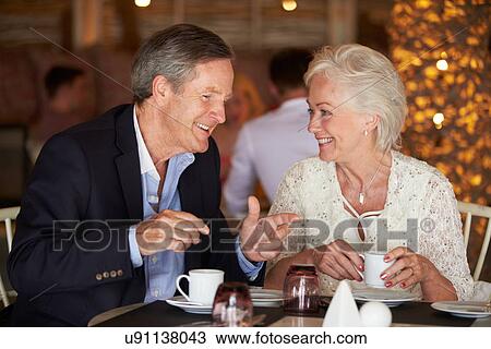 Senior Couple Enjoying Cup Of Coffee In Restaurant View Large Photo Image Stock Image - Senior Couple Enjoying Cup Of Coffee In Restaurant. Fotosearch