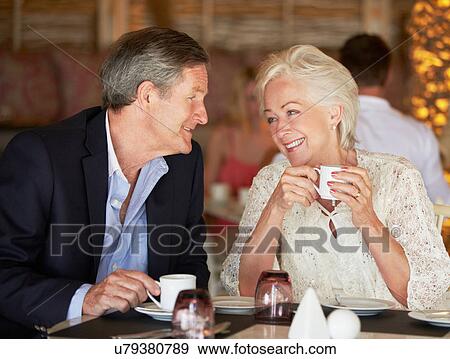 Stock Photo - Senior Couple Enjoying Cup Of Coffee In Restaurant. Fotosearch