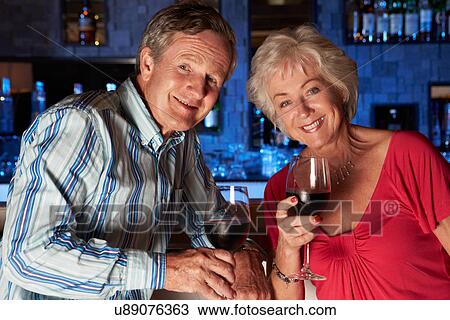 Senior Couple Enjoying Drink In Bar View Large Photo Image Stock Image - Senior Couple Enjoying Drink In Bar. Fotosearch