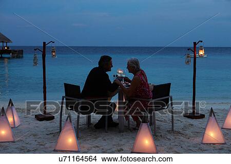 Senior Couple Enjoying Late Meal In Outdoor Restaurant View Large Photo Image Picture - Senior Couple Enjoying Late Meal In Outdoor Restaurant. Fotosearch